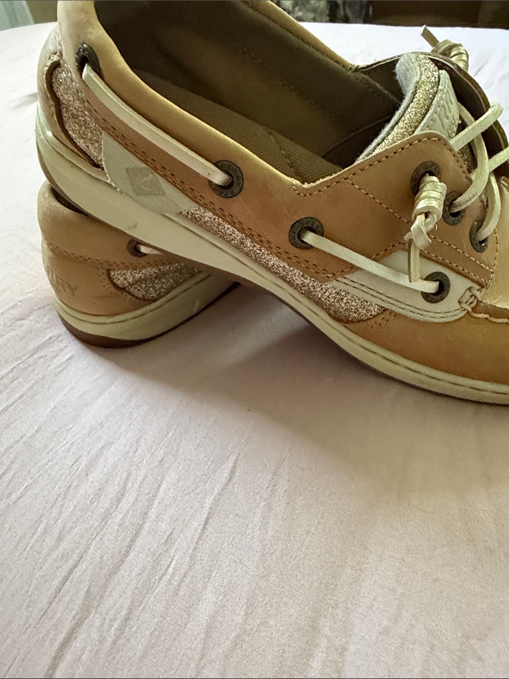 Sperry boat shoes with gold accents